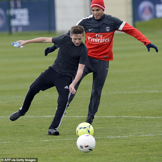 Brooklyn had trained trials at several clubs and was occasionally seen on the training pitch at David's clubs - pictured in 2013 playing alongside Brazilian defender Thiago Silva
