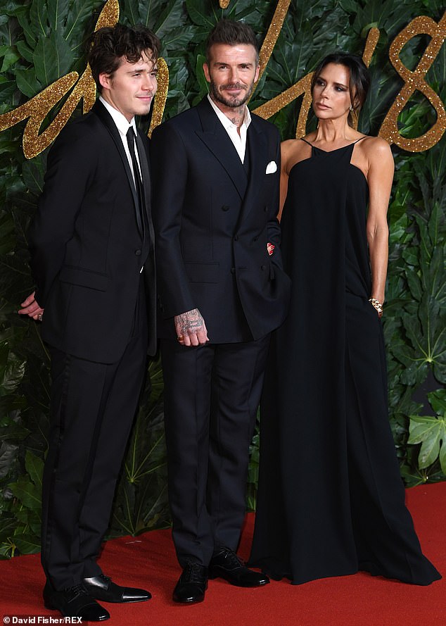 But after his first year he deferred the course for an internship with a respected unnamed British photographer and returned home to his family (Seen with David and Victoria in 2018)