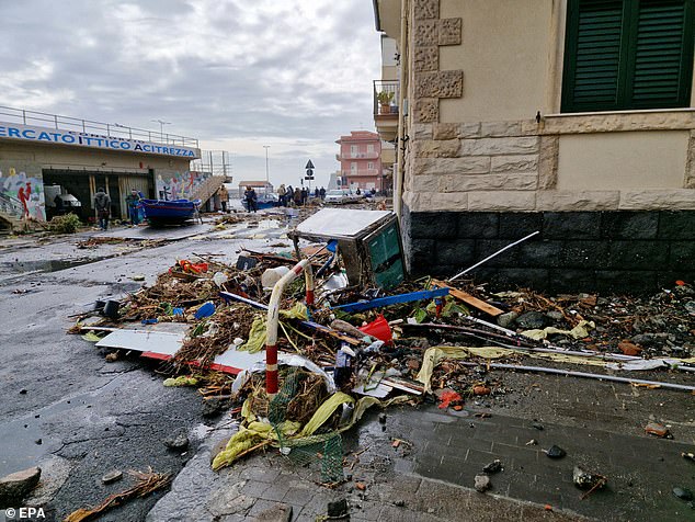 Debris can be seen on the sea front in Aci Trezza, Italy following a storm surge on January 21, 2026