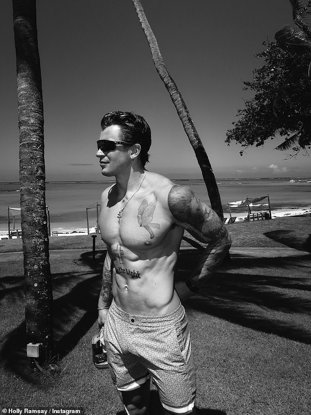 Another image showed Adam displaying his muscular physique as he went shirtless while surveying the picturesque views