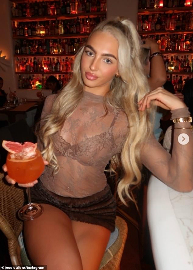 A woman poses with her cocktail as she enjoys a drink at the chain's Manchester location