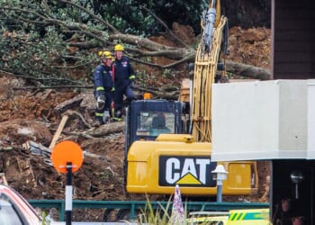 Desperate search for missing children after terrifying landslide rips through campsite burying tourists in New Zealand