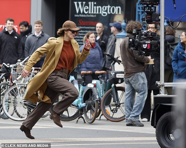The actress is seen sprinting through the streets of London, dressed as spy Helen Webb, while filming scenes for the second series of the Netflix show