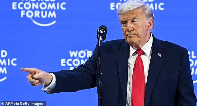 TOPSHOT - US President Donald Trump gestures during the World Economic Forum (WEF) annual meeting in Davos on January 21, 2026. The World Economic Forum takes place in Davos from January 19 to January 23, 2026. (Photo by Fabrice COFFRINI / AFP via Getty Images)