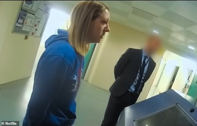 Letby at a police station reception desk, where suspects are usually charged