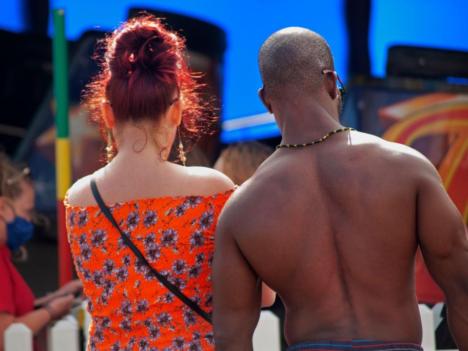 A Black man and a white woman on holiday in Brighton, England.