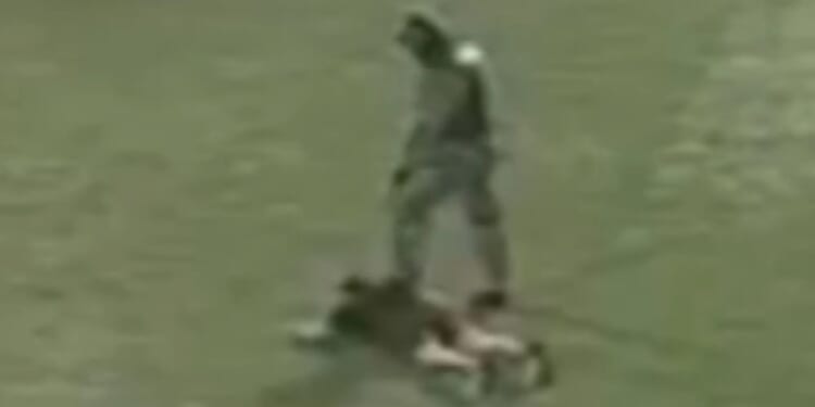 Horror moment killers dressed as cops storm football match before opening fire and killing three