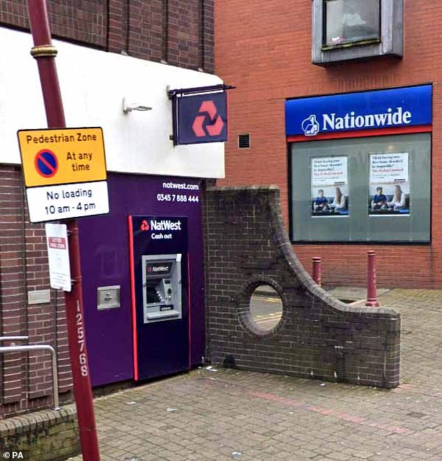 Tourists enjoy the house in Millport on Great Cumbrae Island, Ayrshire