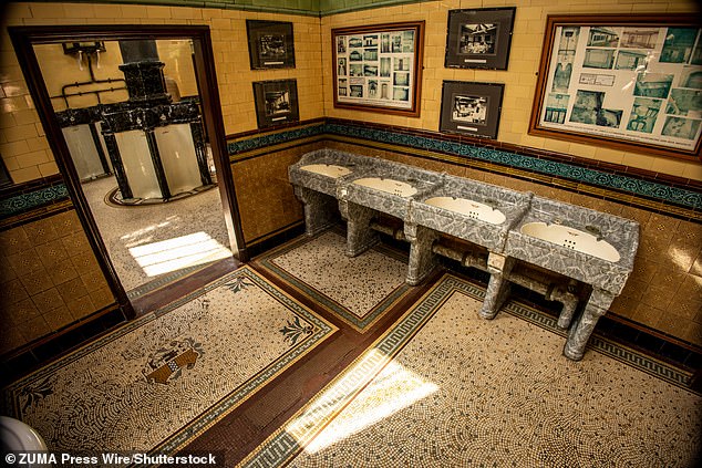 The marble and tile sinks of these Victorian toilets are part of the appeal