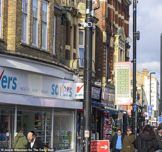 The cameras are seen high up on a lamppost at the edge of Croydon high street