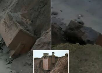 Nuke bunker left teetering on edge of eroded cliff crashes onto beach just days after historian predicted fall