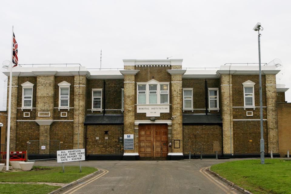 Entrance to HMP Rochester, a brick building with a sign that says "BORSTAL INSTITUTION 19 08."