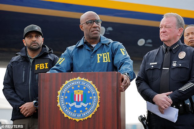 Akil Davis, Assistant Director in Charge of the FBI LA Field Office, speaks while standing next to FBI Director Kash Patel, during an announcement of the apprehension of Ryan Wedding