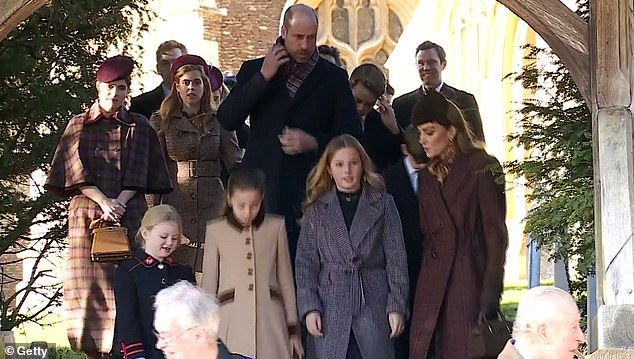 As she walked beside him, William avoided making eye contact with Eugenie and instead remained focused on fixing his scarf before catching up with the Princess of Wales in front of him (right)