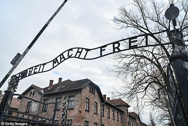The entrance gate of Auschwitz concentration camp that reads 'Arbeit Macht Frei' (Work Sets You Free)