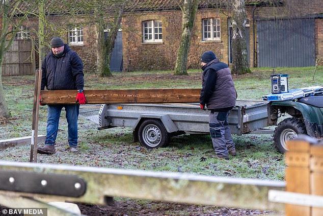 Workmen carry out jobs at Marsh Farm as the property is prepped for the former Prince