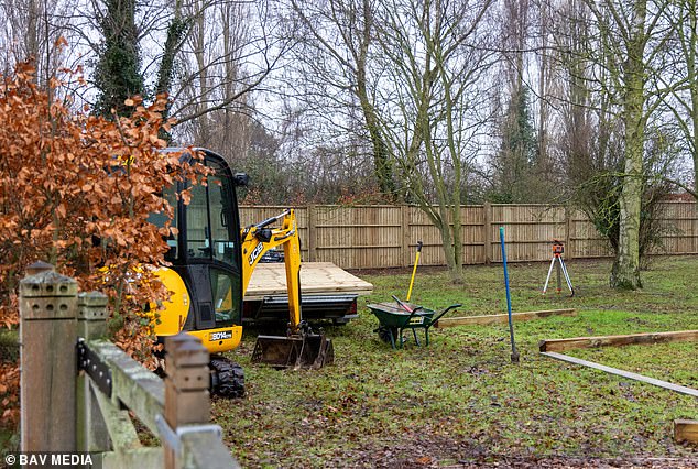 A solid six-foot high wooden fence has sprung up around parts of the Marsh Farm perimeter