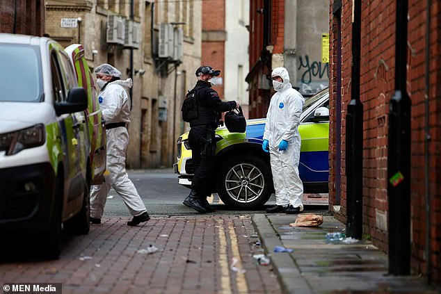 Armed officers descended on the scene and uncovered a gun inside the property on Richmond Street, which runs adjacent to Canal Street, with detectives believing the shooting was 'targeted'