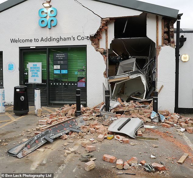 The trail of destruction left behind after a gang used a telehandler to bust through the wall of a Coop to steal a cash machine