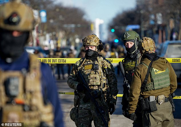 At least one flash-bang exploded as agents pushed protesters back with tear gas