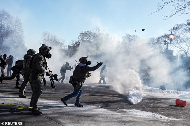 Federal agents threw a crowd-control weapon amid tear gas during scuffles at the scene of a shooting involving federal immigration agents