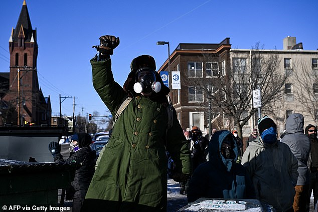 Protesters wore gas masks as demonstrators gather near the site