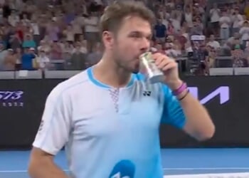 Three-time Grand Slam champion, 40, sinks can of beer on court after heroic battle in last ever Australian Open match