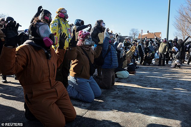 Residents are shouting at agents, calling them 'Nazis' and insisting that all immigrants are welcome, while others are frantically trying to move their parked cars out of the area