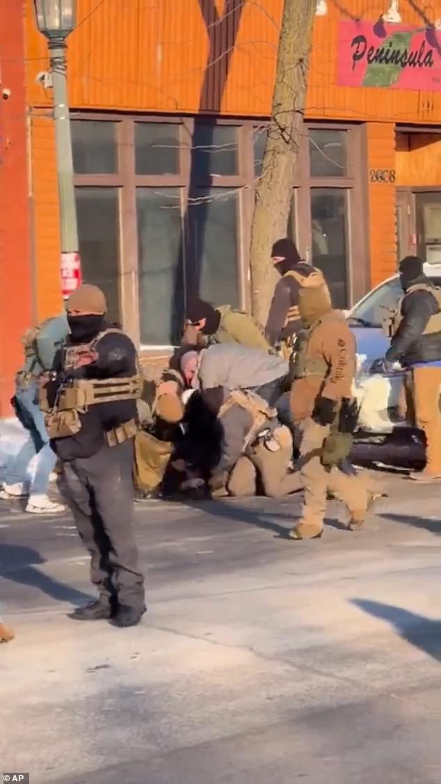 Officers and civilians tumbled to the ground in a pile-up