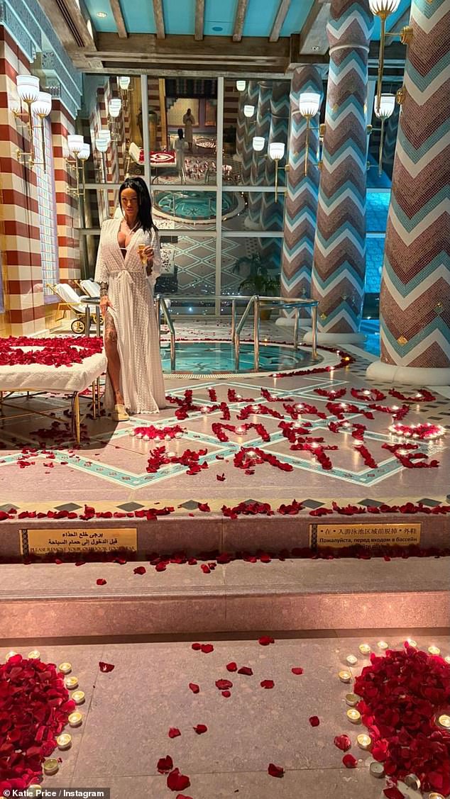 Katie showed off her new man's proposal on social media, where he wrote 'will you marry me' in rose petals on the floor