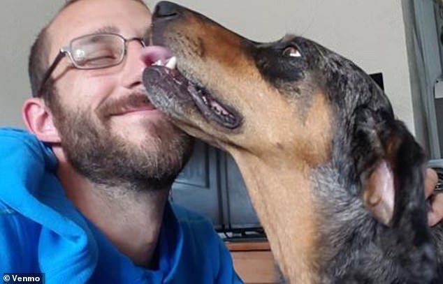 Pretti is pictured with his pet, Joule, a Catahoula Leopard dog, who recently died