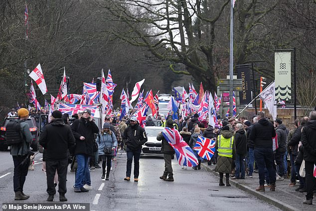 The crowd gathered outside the gates of the camp and made its way into the centre of town