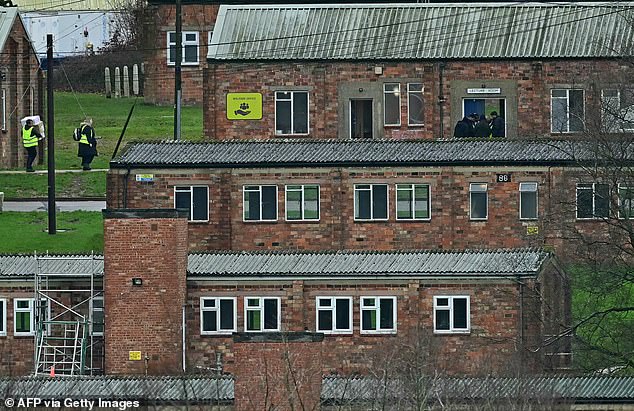 A group of men were seen walking into the own lecture room at Crowborough Army Training Camp