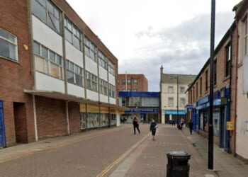 Woman in her 40s dies after fight outside town centre bar as teenager arrested over 'murder'