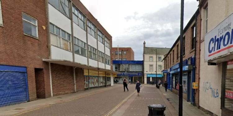 Woman in her 40s dies after fight outside town centre bar as teenager arrested over 'murder'