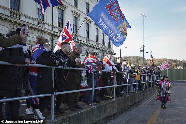 Anti-immigration protesters carrying the Union and St George's flags at an entrance to Dover Docks on Saturday