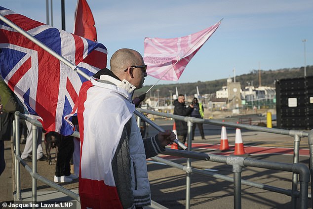Anti-immigration protesters carrying the Union and St George's flags gather at an entrance to Dover Docks while taking part in a demonstration named Operation Overlord at Dover Docks