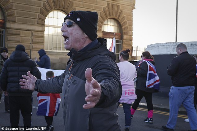 A protester in Dover pictured shouting during a march after the group had been to a nearby pub
