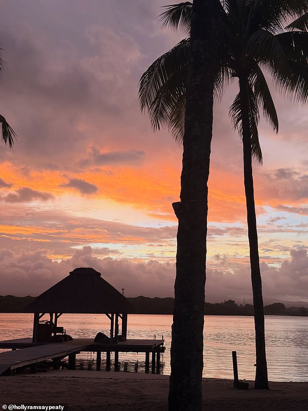 The loved-up couple watched the sunset over the ocean during their lavish honeymoon