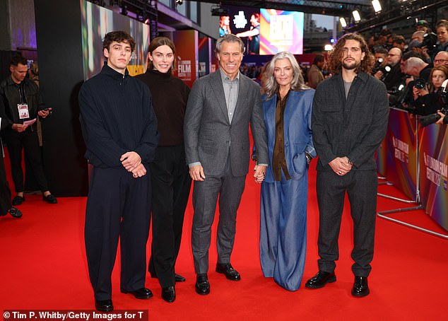 John and Melanie are pictured with sons (L-R) Daniel, Luke, and Joe at the European premiere of Is This Thing On? in October