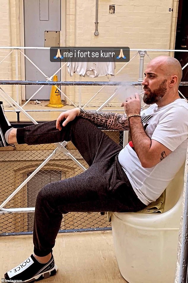 Merizaj has posed on Instagram wearing £550 Dolce & Gabbana trainers outside his cell vaping with the caption 'stronger than ever' written in Albanian