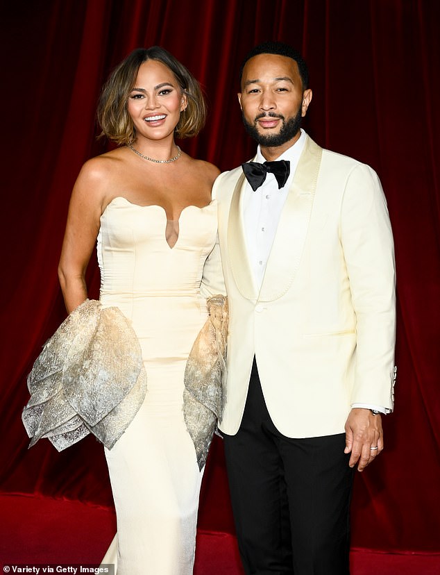 John Legend seems to be a bit shorter than his wife, supermodel Chrissy Teigen. That is because she often wears six-inch heels when they are on the red carpet together. They are the exact same height: 5ft 9in. Seen in 2024