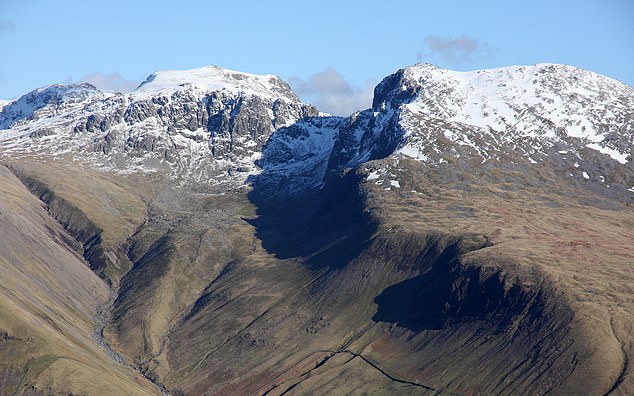 The men were helped down from England's highest mountain (pictured) in a seven-hour rescue