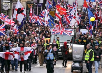 Thousands of protesters take to streets after 27 migrants moved into former military camp in dead of night