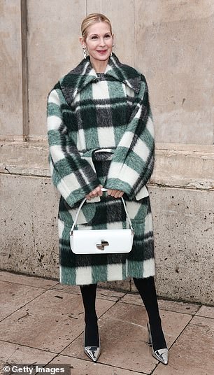 Kelly Rutherford wrapped up in a green checked coat