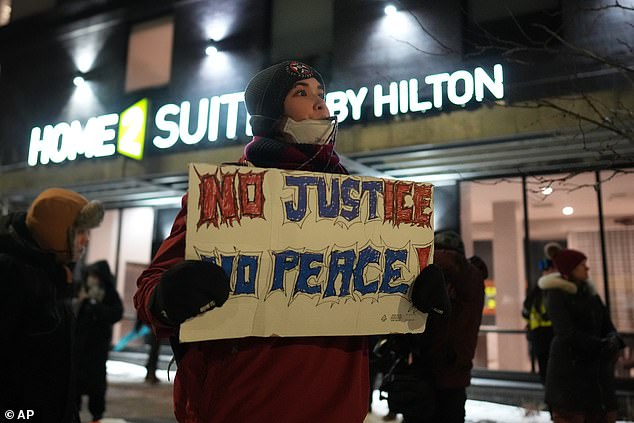 One protestor held a sign reading 'no justice, no peace' at the Sunday demonstration