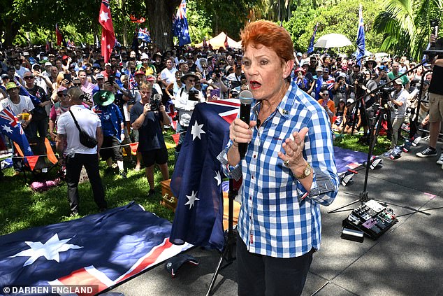 One Nation Leader Pauline Hanson is seen with people attending the March for Australia rally during Australia Day celebrations in Brisbane, Monday, January 26, 2026. (AAP Image/Darren England ) NO ARCHIVING