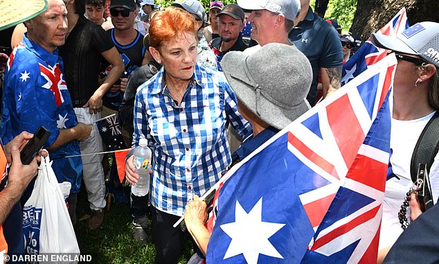 One Nation Leader Pauline Hanson is seen with people attending the March for Australia rally during Australia Day celebrations in Brisbane, Monday, January 26, 2026. (AAP Image/Darren England ) NO ARCHIVING