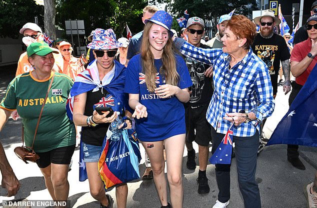 One Nation Leader Pauline Hanson is seen with people attending the March for Australia rally during Australia Day celebrations in Brisbane, Monday, January 26, 2026. (AAP Image/Darren England ) NO ARCHIVING