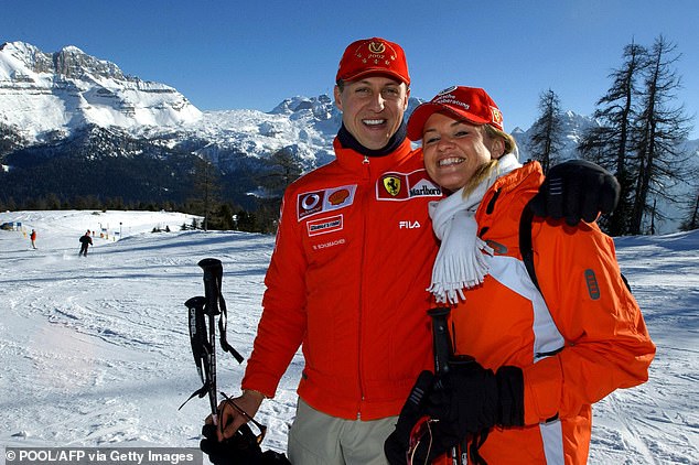 Michael and Corinna are pictured skiing a year before his crash on the slopes in the Alps